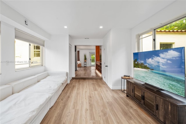 living room with light hardwood / wood-style flooring