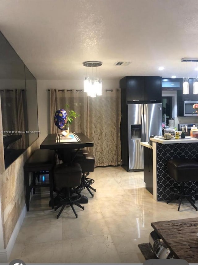 dining space featuring an inviting chandelier