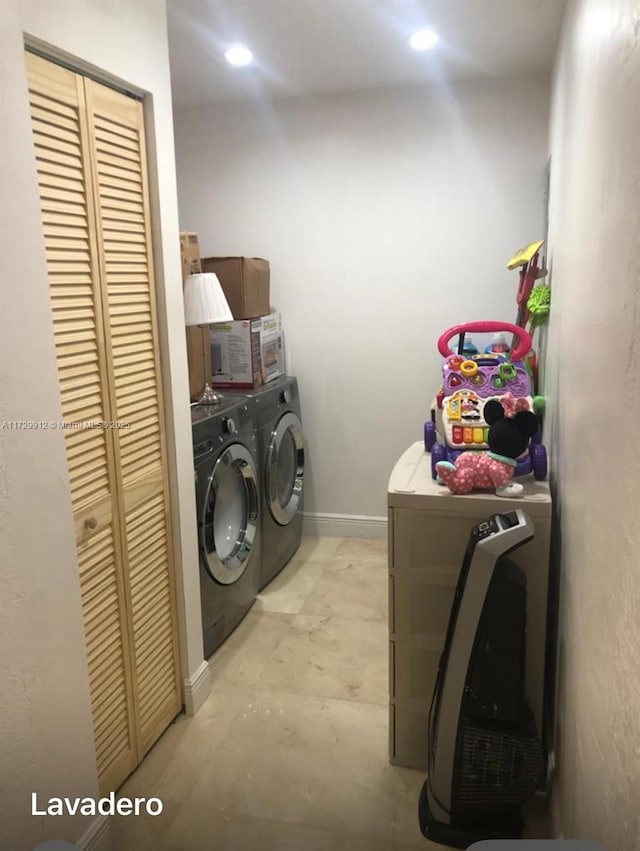 laundry area with separate washer and dryer