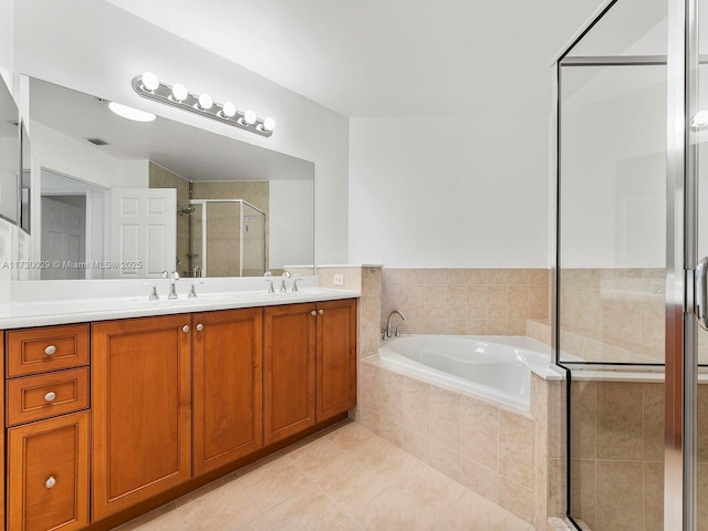 bathroom with vanity, separate shower and tub, and tile patterned flooring