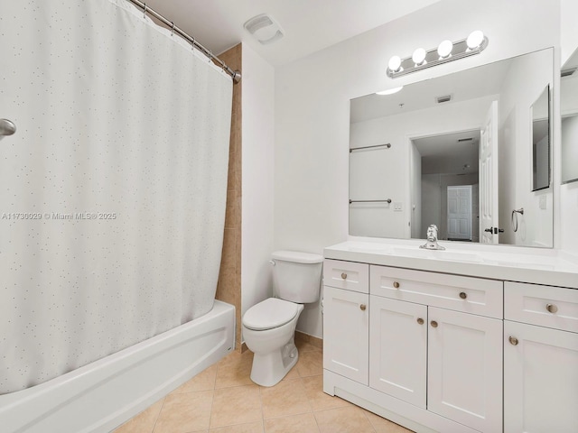 full bathroom featuring vanity, toilet, shower / bath combo with shower curtain, and tile patterned flooring