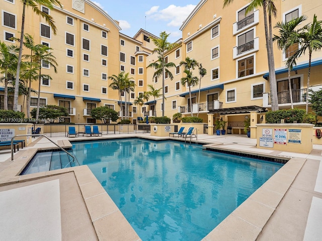 view of swimming pool featuring a patio area