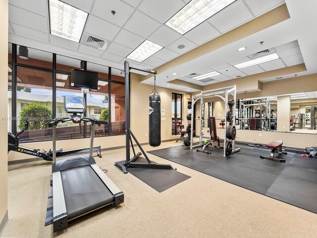 exercise room featuring a paneled ceiling