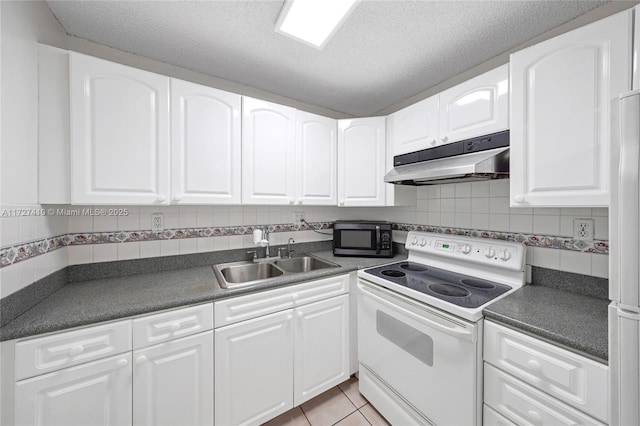 kitchen featuring sink, light tile patterned floors, backsplash, white electric range oven, and white cabinets