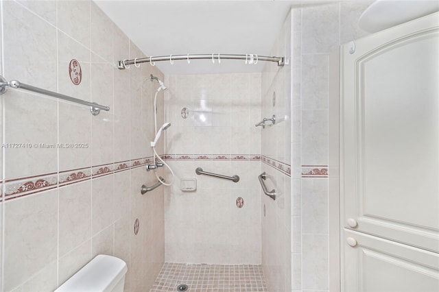 bathroom with a tile shower