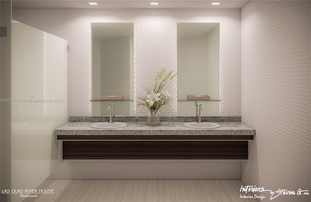 bathroom with hardwood / wood-style flooring and vanity