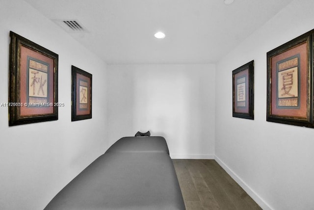 bedroom featuring dark hardwood / wood-style flooring