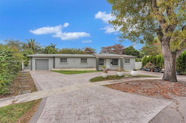 single story home with a garage