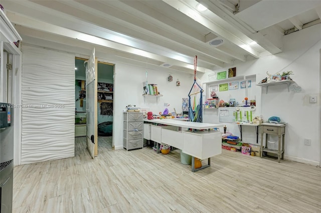 kitchen with kitchen peninsula, light hardwood / wood-style flooring, and a kitchen bar