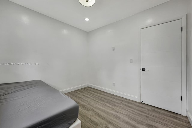 bedroom featuring hardwood / wood-style floors