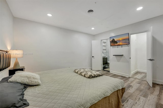 bedroom with light hardwood / wood-style floors