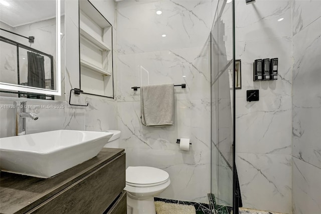 bathroom featuring toilet, vanity, walk in shower, and tile walls