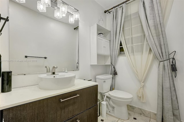 bathroom with toilet and vanity