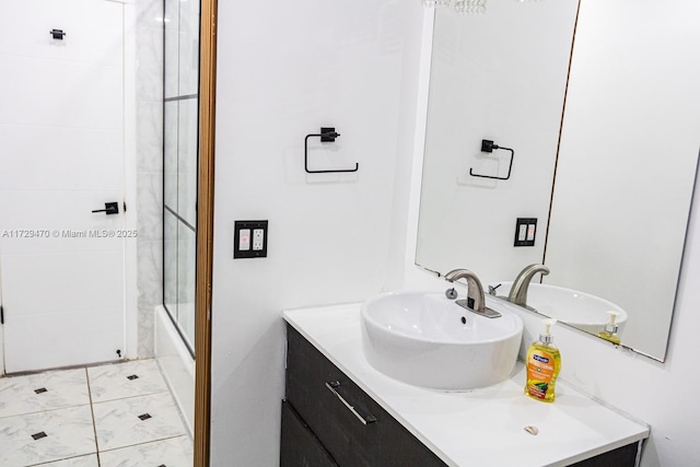 bathroom with bath / shower combo with glass door and vanity