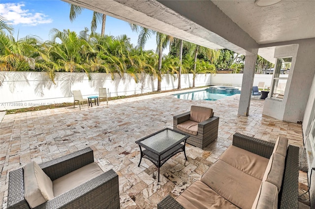 view of pool featuring a water view, a patio, and an outdoor hangout area