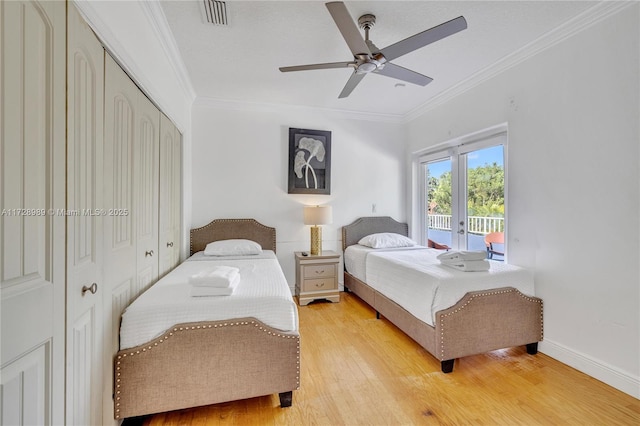 bedroom with ceiling fan, access to exterior, crown molding, and light hardwood / wood-style floors