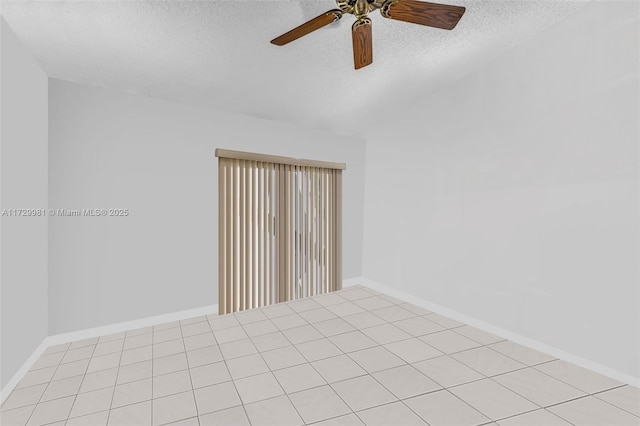 unfurnished room featuring ceiling fan, a textured ceiling, and light tile patterned flooring