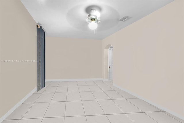 empty room featuring ceiling fan and light tile patterned flooring