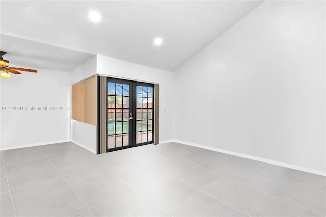 spare room featuring ceiling fan, light tile patterned floors, lofted ceiling, and french doors