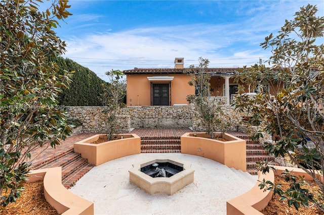 view of patio / terrace with a fire pit