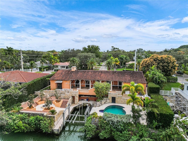 exterior space featuring a patio area and a water view