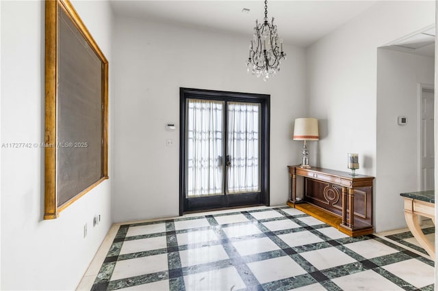 entrance foyer with a chandelier