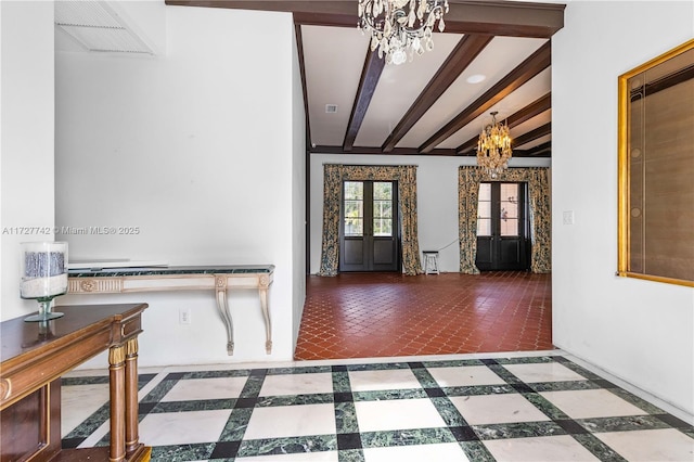 foyer entrance featuring french doors, a chandelier, and beam ceiling