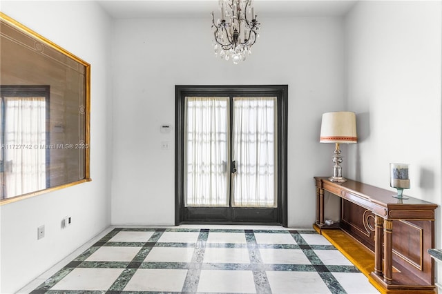 entryway featuring a chandelier and a healthy amount of sunlight