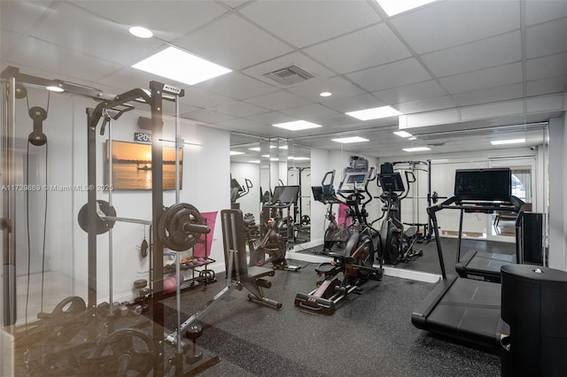 gym featuring a drop ceiling