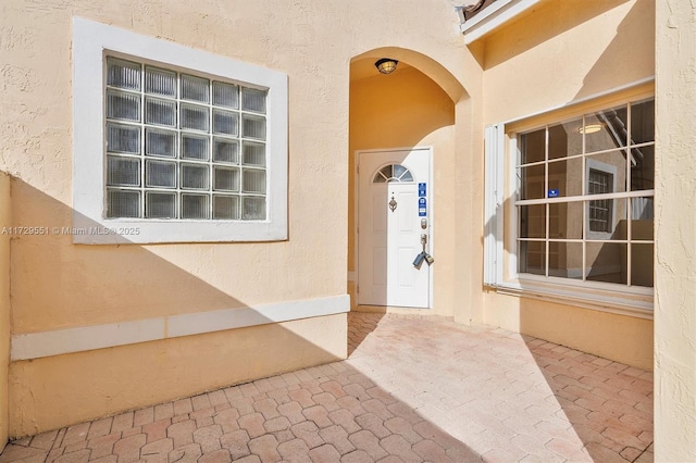 doorway to property featuring a patio