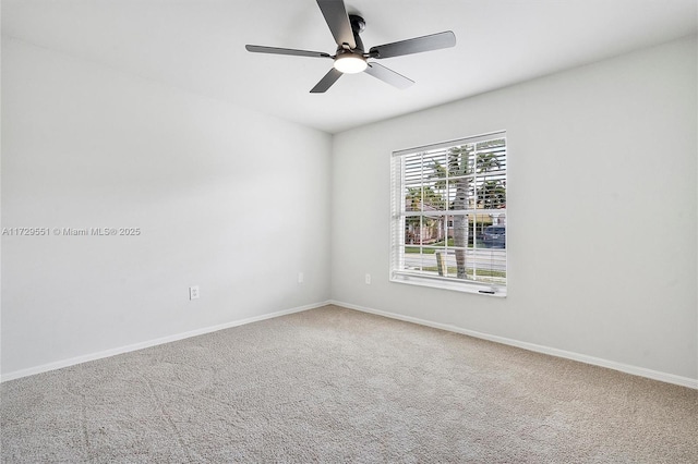 unfurnished room with carpet flooring and ceiling fan