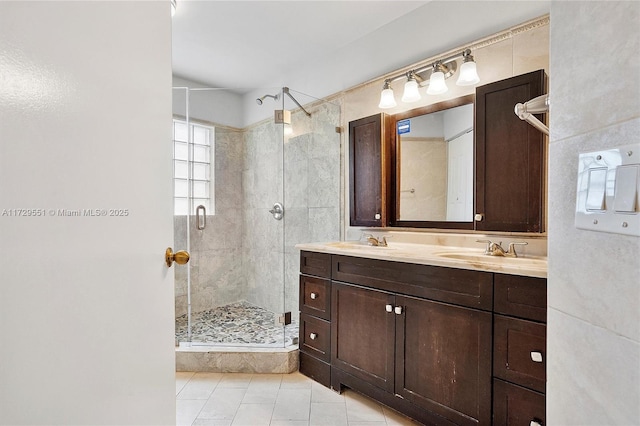 bathroom featuring vanity, tile patterned floors, and walk in shower