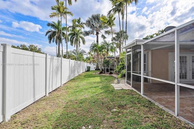 view of yard with a lanai