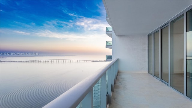 balcony at dusk with a water view