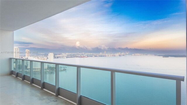 balcony at dusk with a water view