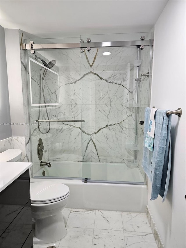 full bathroom featuring bath / shower combo with glass door, vanity, and toilet