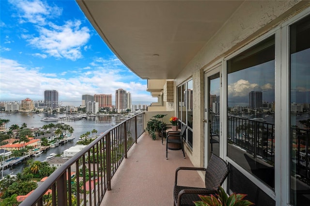 balcony featuring a water view