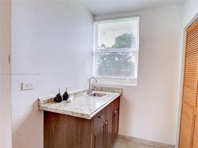 interior space with tile patterned floors and vanity