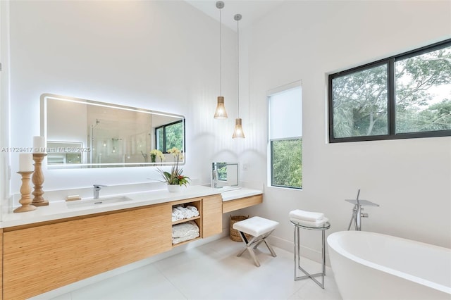 bathroom featuring vanity, independent shower and bath, and tile patterned floors