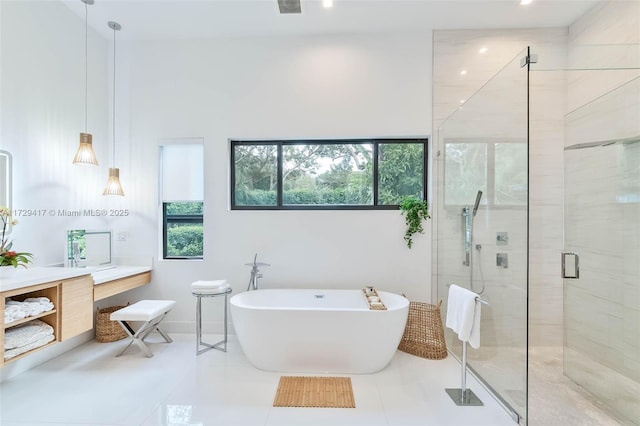 bathroom featuring independent shower and bath and tile patterned floors