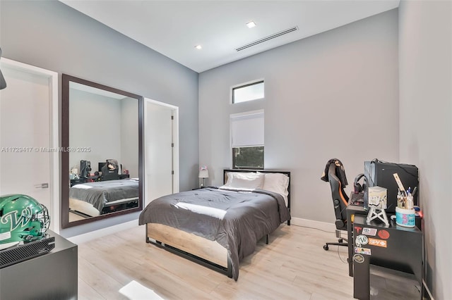 bedroom with light hardwood / wood-style floors