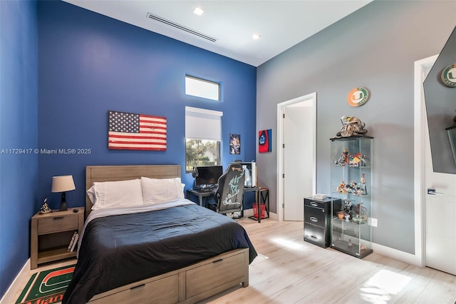 bedroom featuring light wood-type flooring