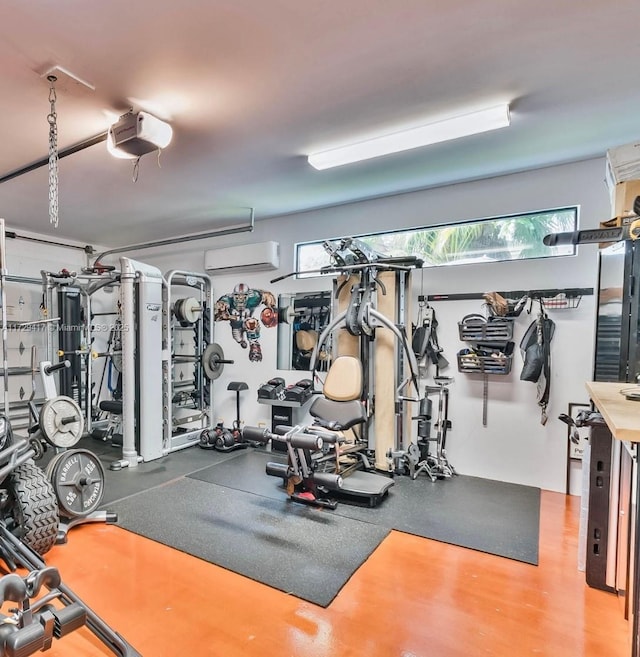 workout area with a healthy amount of sunlight and a wall mounted air conditioner