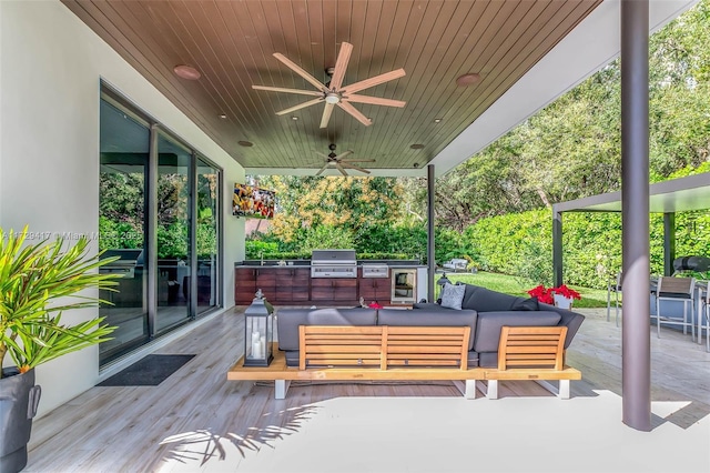 view of patio / terrace with area for grilling, grilling area, an outdoor living space, and ceiling fan