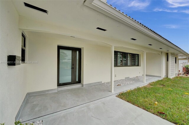 ranch-style house with a garage and a front lawn