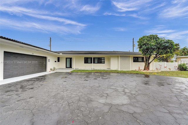 ranch-style home with a garage