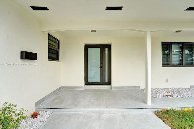 property entrance with a patio area