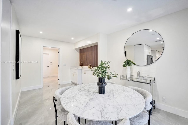 dining space featuring sink