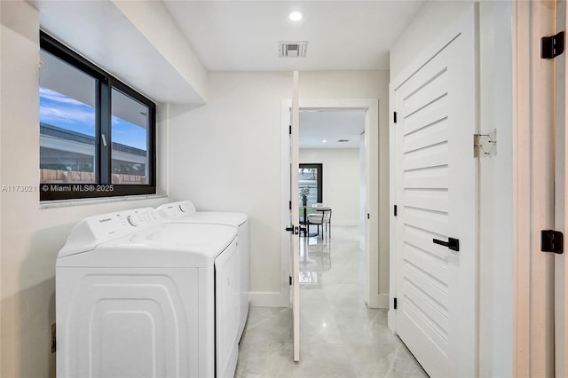 laundry room featuring washing machine and dryer