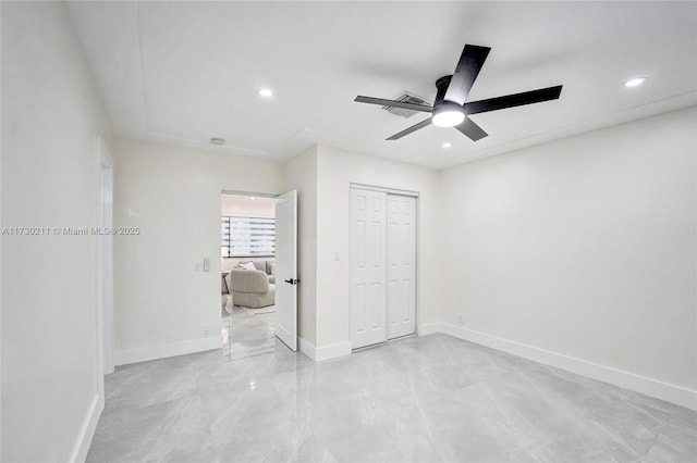 unfurnished bedroom with a closet and ceiling fan